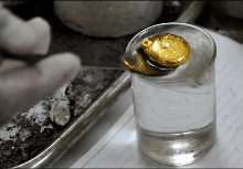 Scoop gold out from crucible when it coagulated. Suddenly fill in distilled water. Because of if gold lost heat, gold will adhere with the crucible