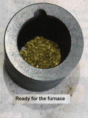 metal melting furnace filled with gold