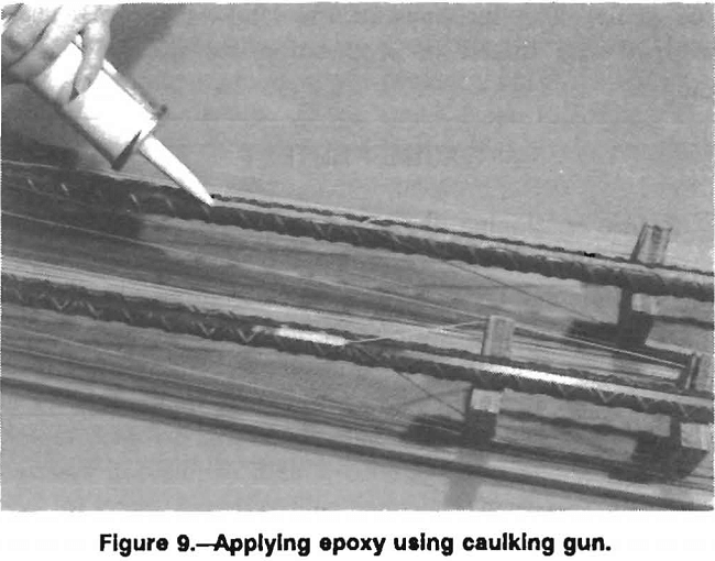 rock bolt applying epoxy using caulking gun